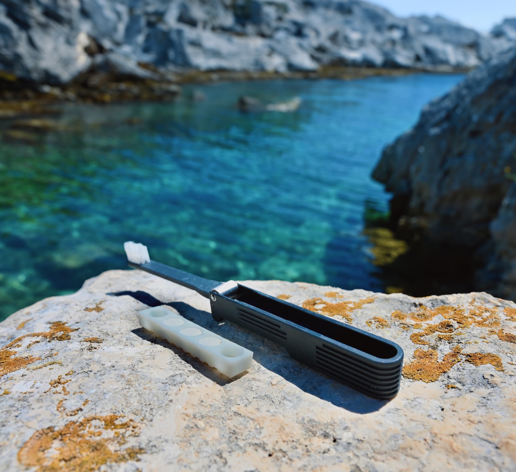 Roam open on a rock by turquoise water
